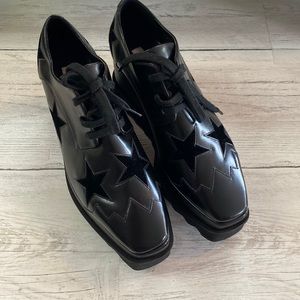 Stella McCarthey Elyse black star platform sneakers